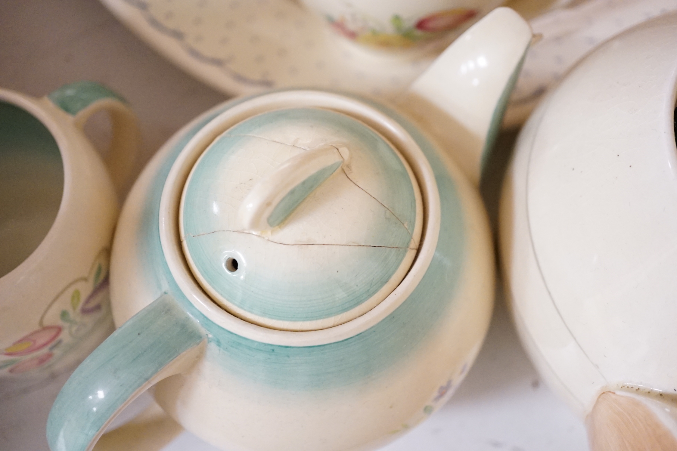 A collection of Susie Cooper ceramics and tablewares including tureens, an oval platter, cups and saucers